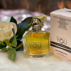 Perfume bottle and packaging of Emporio Armani 'Because It's You' on a soft surface with flowers.
Because It’s You Eau de Parfum by Emporio Armani is a radiant and playful scent designed for the confident woman in love. It blends sweet fruity notes with deep florals and a sensual vanilla base. This 100% authentic imported tester combines luxury with lasting performance without the designer price tag.