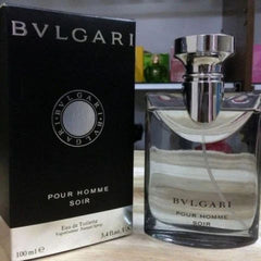 Bulgari Pour Homme Soir perfume bottle and packaging on a wooden surface.
Bvlgari Pour Homme Soir Eau de Toilette is crafted for the modern gentleman who appreciates elegance, subtle power, and refined style. This iconic scent is a harmonious blend of citrus, woods, and musky undertones, ideal for evening wear or formal settings. With its captivating charm and understated strength, this 100% authentic imported tester offers luxury without the luxury price tag.