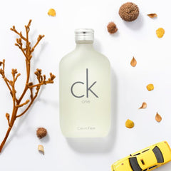 Calvin Klein CK One perfume bottle on a white background with decorative elements.
CK One Eau de Toilette by Calvin Klein is the ultimate unisex fragrance. A crisp, citrusy blend that’s modern, refreshing, and universally loved. Whether you’re headed to the office, gym, or out on the town, CK One keeps you feeling fresh, light, and energized. This 100% authentic imported tester gives you timeless Calvin Klein quality without the luxury price.