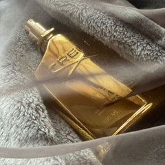 Gold perfume bottle on a gray textured surface
Creed Millesime Imperial is a masterpiece of refinement, crafted for men and women who desire elegance, freshness, and luxury in every spray. Inspired by the romance of the Mediterranean, this 100% authentic imported tester combines salty sea accords, citrus brightness, and warm musky woods all with Creed’s signature artistry, without the premium price tag.