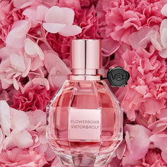 Flowerbomb Eau de Parfum by Viktor & Rolf is a dazzling floral explosion that blends sensuality with sophistication. From its sparkling top notes of Tea, Bergamot, and Osmanthus, to its lush floral heart of Orchid, Jasmine, Freesia, Rose, and African Orange Flower, this fragrance is both romantic and radiant. The rich base of Patchouli, Musk, and Vanilla wraps it all together with warmth and depth. This 100% authentic imported tester brings you the same luxurious scent and performance as the retail