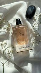 Giorgio Armani Si Eau de Parfum is a timeless and sophisticated scent crafted for the modern woman. This 100% authentic imported tester delivers a bold yet graceful composition with fruity, floral, and warm undertones. With top notes of Cassis, a heart of May Rose and Freesia, and a smooth base of Vanilla and Patchouli, this fragrance leaves a lasting, sensual trail. Our tester version offers the unforgettable experience at a better price.