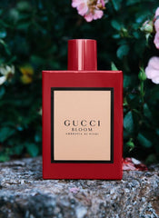 Red Gucci Bloom perfume bottle on a stone surface with flowers in the background
Gucci Bloom Ambrosia di Fiori Eau de Parfum is a deeper, more luxurious interpretation of the original Bloom. This bold floral blends rare blossoms with elegant powdery undertones perfect for the confident woman who seeks a more intense, expressive signature scent. This 100% authentic imported tester delivers true Gucci quality at unbeatable price.