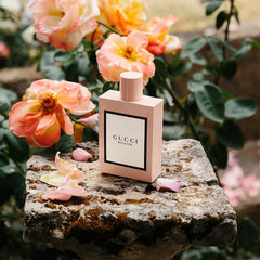 Gucci Bloom perfume bottle on a stone surface with flowers in the background
Gucci Bloom Eau de Parfum is an enchanting celebration of white florals, created for the modern woman who flourishes in her own authenticity. Rich, radiant, and irresistibly luxurious, this 100% authentic imported tester delivers the elegance of Gucci without the designer price tag.