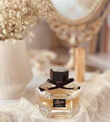 Gucci Flora perfume bottle on a decorative surface with flowers and mirror in the background
Gucci Flora Eau de Parfum is a charming blend of delicate flowers, fruit, and soft woody undertones – perfect for the woman who radiates grace and confidence. This 100% authentic imported tester offers luxurious performance and iconic scent quality, all without the premium price tag.