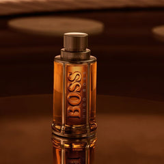 Hugo Boss perfume bottle on a reflective surface with a brown background
Hugo Boss The Scent Eau de Toilette is a bold and captivating composition that blends spicy freshness with rich, masculine warmth. Designed for the modern man who knows the power of attraction, this 100% authentic imported tester delivers luxury, intensity, and sophistication without the premium price tag.