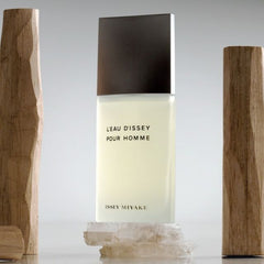 Issey Miyake Léau Dissey Pour Homme perfume bottle with wooden elements on a gray background
L’Eau D’Issey Pour Homme by Issey Miyake is a refined, refreshing scent for men who appreciate balance and elegance. Inspired by water's clarity and power, this 100% authentic imported tester offers a crisp, woody-aquatic blend perfect for everyday wear. A masterclass in minimalism, it combines bold citrus, spicy warmth, and smooth woody notes all without the luxury markup.