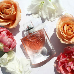 Perfume bottle surrounded by flowers on a light background
La Vie Est Belle Eau de Parfum by Lancôme is a timeless expression of joyful femininity, crafted with a blend of luxurious florals, sweet fruits, and warm gourmand notes. Designed for the confident and radiant woman, this 100% authentic imported tester delivers long-lasting elegance and charm without the designer price tag.