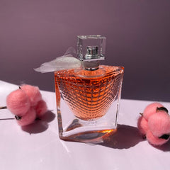 Perfume bottle with decorative pink elements on a white surface
La Vie Est Belle Eau de Parfum by Lancôme is a timeless expression of joyful femininity, crafted with a blend of luxurious florals, sweet fruits, and warm gourmand notes. Designed for the confident and radiant woman, this 100% authentic imported tester delivers long-lasting elegance and charm without the designer price tag.