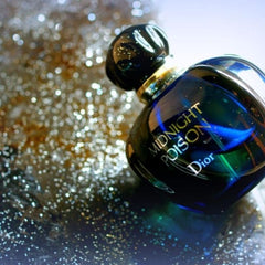 Dior Midnight Poison perfume bottle on a glittery background
Midnight Poison Eau de Parfum by Dior is a powerful and enigmatic scent. Wrapped in rich florals, deep woods, and warm ambers, it’s designed for the bold and confident woman who thrives under moonlight. This 100% authentic imported tester delivers the signature sophistication of Dior with irresistible depth and charm.