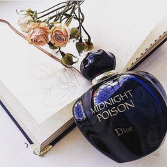Dior Midnight Poison perfume bottle on an open book with flowers
Midnight Poison Eau de Parfum by Dior is a powerful and enigmatic scent. Wrapped in rich florals, deep woods, and warm ambers, it’s designed for the bold and confident woman who thrives under moonlight. This 100% authentic imported tester delivers the signature sophistication of Dior with irresistible depth and charm.