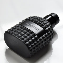 Black perfume bottle with diamond pattern and 'Valentino' branding on a white background
Valentino Uomo Intense Eau de Parfum is a refined, luxurious scent that blends rich, warm notes of leather, vanilla, and tonka bean with a touch of iris and citrus for a smooth yet powerful finish. A 100% authentic imported tester, offering premium quality and lasting intensity at an unbeatable price.