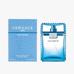 A product image showing a box and bottle of Versace Man Eau Fraiche EDT 100ml. The box is predominantly white with blue text and design elements, while the bottle is a clear glass with a blue cap and label.
Versace Man Eau Fraîche is a refreshing take on modern masculinity, cool, clean, and charismatic. Blending crisp citrus, aromatic herbs, and deep woody notes, this scent is designed for the man who is effortlessly stylish and refined. This 100% authentic imported tester offers luxury performance.