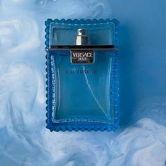 Versace Eau Fraiche perfume bottle on a blue and white smoke
background
Versace Man Eau Fraîche is a refreshing take on modern masculinity, cool, clean, and charismatic. Blending crisp citrus, aromatic herbs, and deep woody notes, this scent is designed for the man who is effortlessly stylish and refined. This 100% authentic imported tester offers luxury performance without the premium price.