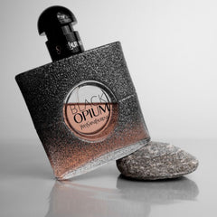 Yves Saint Laurent Black Opium Eau de Parfum is an iconic scent crafted for the bold, daring woman. This intoxicating blend of coffee, vanilla, and white flowers creates a mesmerizing contrast of dark richness and luminous femininity. A 100% authentic imported tester, offering luxury and intensity at an unbeatable price.