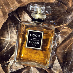 Chanel Coco Eau de Parfum bottle on a reflective surface
Chanel Coco Eau de Parfum is a tribute to timeless femininity _a deep, floral-oriental scent laced with romantic rose, seductive spices, and warm amber. It’s crafted for the confident woman who embraces her inner strength and desires a luxurious signature scent that lingers. This 100% authentic imported tester delivers iconic Chanel sophistication minus the luxury price tag.