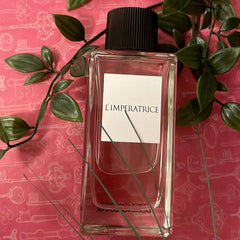 Perfume bottle labeled 'L'Imperatrice' on a pink background with green leaves.
Dolce &amp; Gabbana L’Imperatrice Eau de Toilette is a vibrant tribute to modern femininity. Bursting with tropical fruits, delicate florals, and a creamy, comforting base, it’s made for the bold, radiant woman who loves to stand out. This 100% authentic imported tester captures the elegance of Italian luxury without the premium price tag.