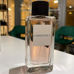 Dolce & Gabbana L'Imperatrice perfume bottle on a white surface with a blurred background
Dolce &amp; Gabbana L’Imperatrice Eau de Toilette is a vibrant tribute to modern femininity. Bursting with tropical fruits, delicate florals, and a creamy, comforting base, it’s made for the bold, radiant woman who loves to stand out. This 100% authentic imported tester captures the elegance of Italian luxury without the premium price tag.