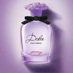 Dolce & Gabbana Peony perfume bottle on a purple background
Dolce Peony Eau de Parfum by Dolce &amp; Gabbana is a radiant tribute to the elegance of spring in bloom. With delicate peony, juicy fruits, and warm musk, it captures the essence of femininity with a playful yet refined touch. This 100% authentic imported tester delivers Dolce luxury and lasting freshness without the premium price tag.