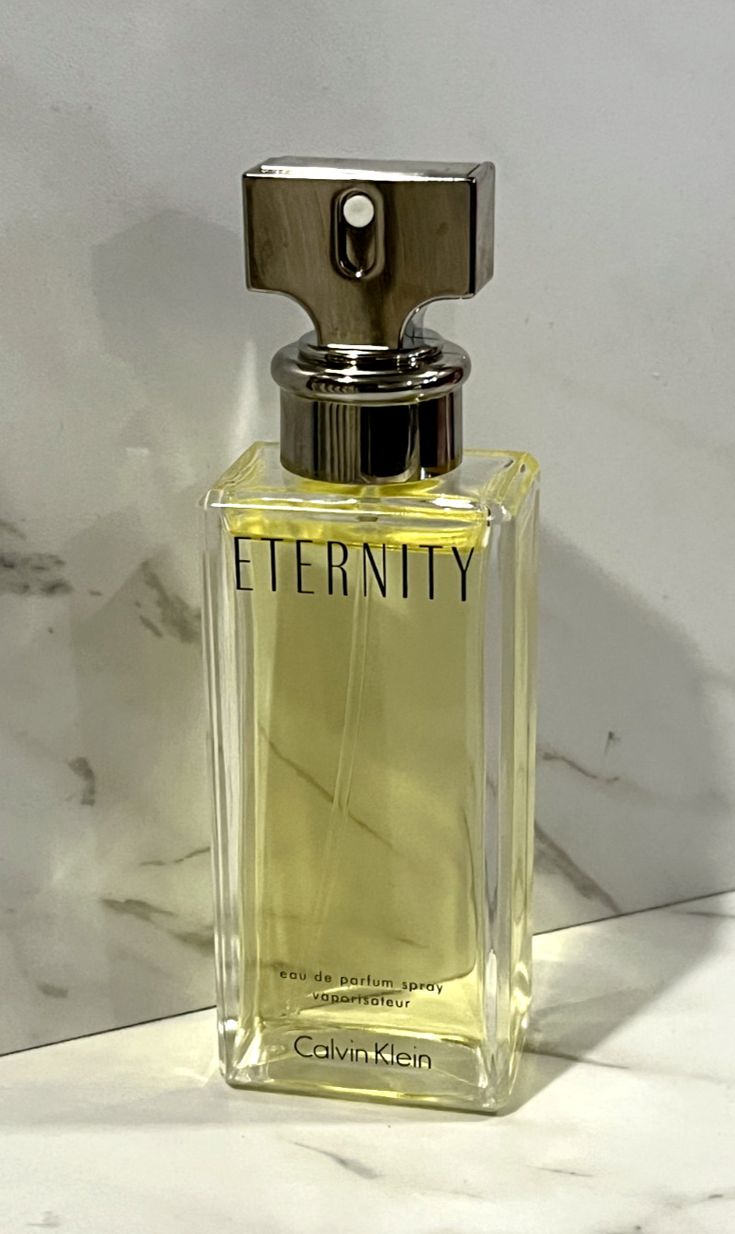 Calvin Klein Eternity perfume bottle on a marble surface
Eternity Eau de Parfum by Calvin Klein is a timeless floral fragrance that blends lush botanicals with soft woods and sensual musk. It's designed for the woman who values elegance, tradition, and emotional depth. This 100% authentic imported tester offers the same sophisticated essence without the luxury price tag.