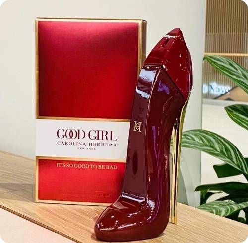 Red high-heeled shoe with 'Good Girl' Carolina Herrera box on a wooden surface.
Good Girl Red Eau de Parfum by Carolina Herrera is a daringly modern scent for women who embrace duality _fierce and fearless, soft yet powerful. With juicy fruits, romantic florals, and deep warm base notes, this 100% authentic imported tester offers high-end fragrance luxury without the high-end price.
