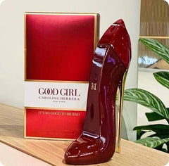 Red high-heeled shoe with 'Good Girl' Carolina Herrera box on a wooden surface.
Good Girl Red Eau de Parfum by Carolina Herrera is a daringly modern scent for women who embrace duality _fierce and fearless, soft yet powerful. With juicy fruits, romantic florals, and deep warm base notes, this 100% authentic imported tester offers high-end fragrance luxury without the high-end price.