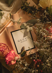 Gucci Bloom perfume box surrounded by flowers and greenery
Gucci Bloom Eau de Parfum is an enchanting celebration of white florals, created for the modern woman who flourishes in her own authenticity. Rich, radiant, and irresistibly luxurious, this 100% authentic imported tester delivers the elegance of Gucci without the designer price tag.