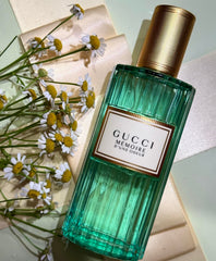 Green Gucci perfume bottle with gold cap on a light background
Gucci Mémoire D’une Odeur Eau de Parfum is a boundary-breaking scent that blends the unexpected softness of Roman chamomile with musky florals and warm woods. Designed for all genders, it evokes a feeling more than a formula. Soft, dreamy, and deeply personal. This 100% authentic imported tester offers Gucci’s signature artistry at an unbeatable value.
