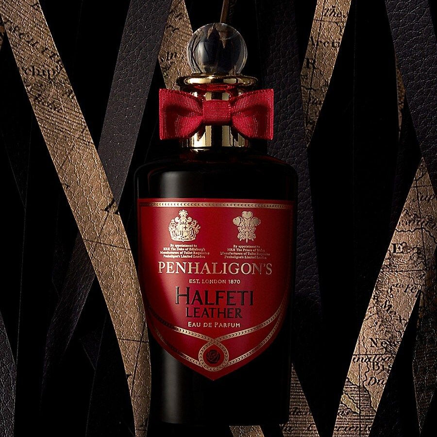 Penhaligon's Halftti Leather perfume bottle with a red bow tie against a dark background
Halfeti Leather Eau de Parfum by Penhaligon’s is a luxurious blend of spices, florals, and smoky leather crafted for those who crave complexity, power, and timeless elegance. Inspired by the mysterious charm of the Middle East, this 100% authentic imported tester exudes sophistication without the luxury markup.