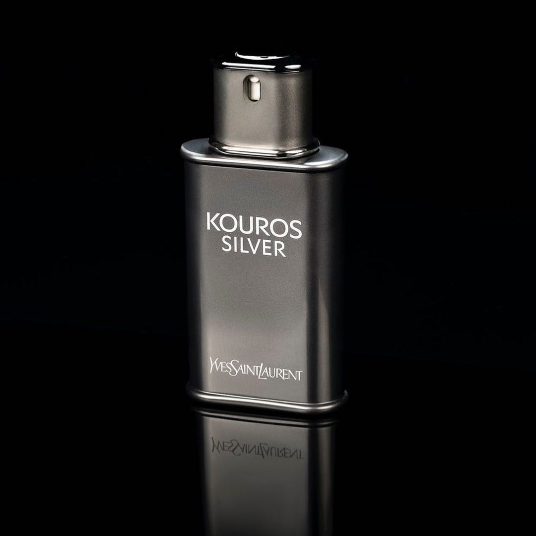 YSL Kouros Silver perfume bottle on a black background
Kouros Silver Eau de Toilette by Yves Saint Laurent is a dynamic reinterpretation of a classic scent. It opens with vibrant fruity freshness, evolves into aromatic elegance, and settles into a warm, woody base. Crafted for the confident and contemporary man, this 100% authentic imported tester offers legendary YSL quality without the designer markup.