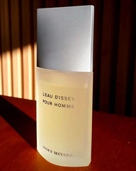 Perfume bottle labeled 'Leau Dissey Pour Homme' by Issey Miyake on a wooden surface.
L’Eau D’Issey Pour Homme by Issey Miyake is a refined, refreshing scent for men who appreciate balance and elegance. Inspired by water's clarity and power, this 100% authentic imported tester offers a crisp, woody-aquatic blend perfect for everyday wear. A masterclass in minimalism, it combines bold citrus, spicy warmth, and smooth woody notes all without the luxury markup.