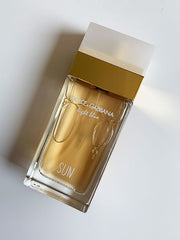 Dolce & Gabbana perfume bottle on a light background
Light Blue Sun Eau de Toilette by Dolce &amp; Gabbana is a sparkling and sensual escape to the Mediterranean. With juicy fruits, floral elegance, and creamy coconut warmth, it’s the perfect scent for those who radiate joy, freshness, and effortless charm. This 100% authentic imported tester brings iconic D&amp;G brightness without the luxury price tag.