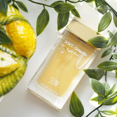 Dolce & Gabbana Light Blue Sun perfume bottle with lemons and green leaves on a white background
Light Blue Sun Eau de Toilette by Dolce &amp; Gabbana is a sparkling and sensual escape to the Mediterranean. With juicy fruits, floral elegance, and creamy coconut warmth, it’s the perfect scent for those who radiate joy, freshness, and effortless charm. This 100% authentic imported tester brings iconic D&amp;G brightness without the luxury price tag.