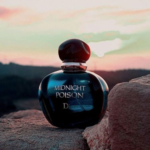 Perfume bottle labeled 'Midnight Poison' on a rock with a scenic background.
Midnight Poison Eau de Parfum by Dior is a powerful and enigmatic scent.&nbsp;Wrapped in rich florals, deep woods, and warm ambers, it’s designed for the bold and confident woman who thrives under moonlight. This 100% authentic imported tester delivers the signature sophistication of Dior with irresistible depth and charm.