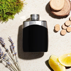 Montblanc black and silver perfume bottle on a textured surface with natural elements like lavender and lemon.
Mont Blanc Legend Eau de Toilette is a refined, masculine scent that blends fruity freshness with rich, woody depth. Top notes of Lavender, Pineapple, and Bergamot, earthy notes, middle of&nbsp;oak moss, Red Apple, and Rose, with base of Tonka Bean and Sandalwood, make the perfect scent for the modern gentleman.&nbsp;This 100% authentic imported tester offers premium quality and performance