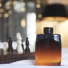 Gradient bottle of alcohol on a table with chess pieces and blurred lights in the background
Mont Blanc Legend Night Eau de Parfum is a captivating scent crafted for the modern man who owns the night. Bold, aromatic top notes lead into a warm, woody heart, finishing with a smooth, sensual base. This 100% authentic imported tester offers premium quality and unforgettable character without the luxury price tag.