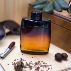 Dark glass perfume bottle on a wooden surface with seeds and a watch in the background
Mont Blanc Legend Night Eau de Parfum is a captivating scent crafted for the modern man who owns the night. Bold, aromatic top notes lead into a warm, woody heart, finishing with a smooth, sensual base. This 100% authentic imported tester offers premium quality and unforgettable character without the luxury price tag.