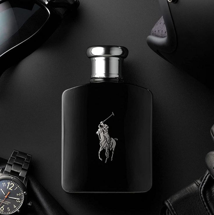 Black Ralph Lauren perfume bottle with sunglasses and a watch on a dark surface
Polo Black Eau de Toilette by Ralph Lauren is a daring blend of vibrant citrus, icy mango, and deep woody accords. Crafted for the contemporary man who embraces life with style and swagger, this fragrance offers both freshness and strength in one sleek bottle. Experience luxury, power, and performance & without the luxury price tag with our 100% authentic imported tester.
