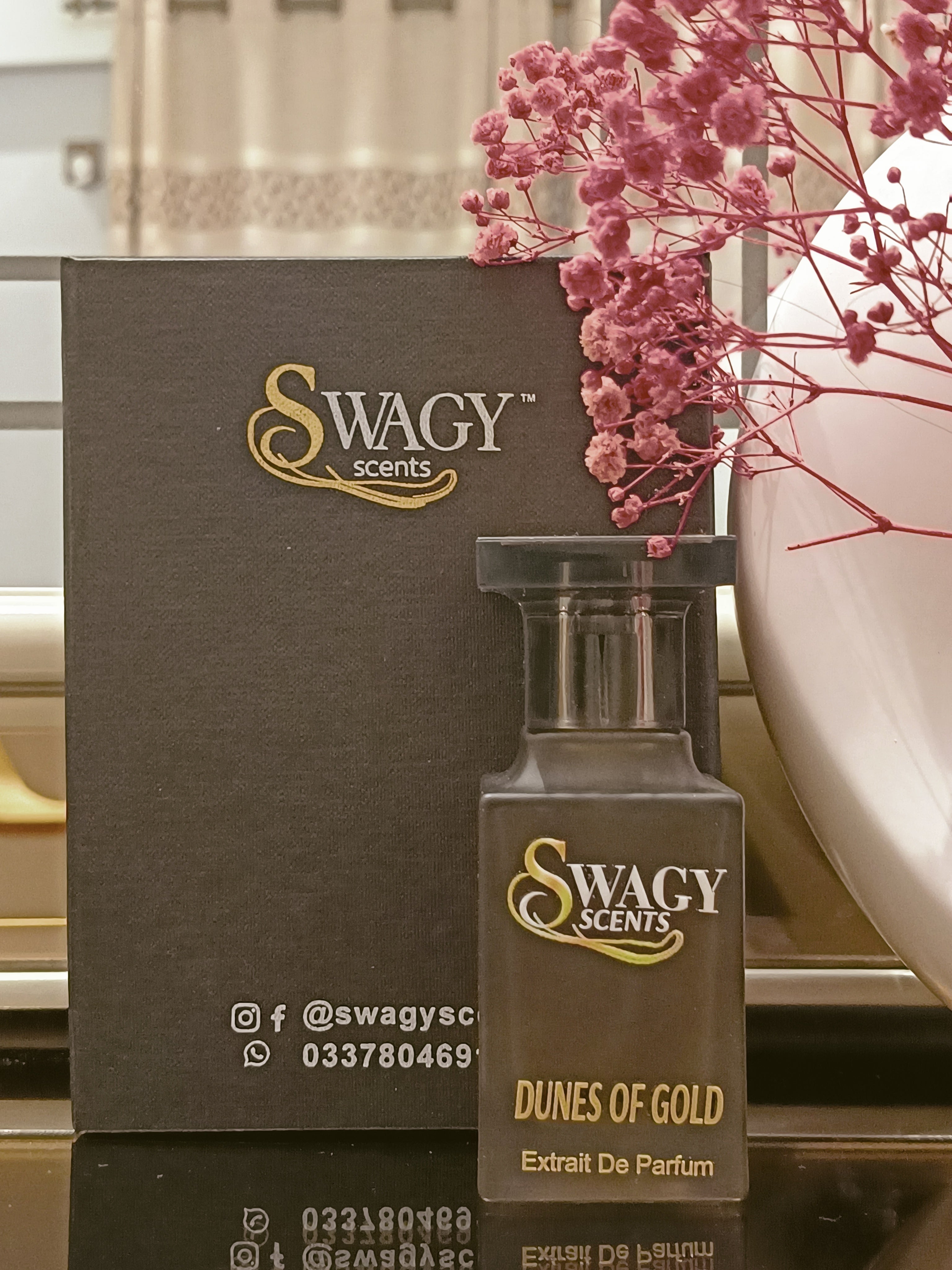 Dunes Of Gold Eau de Parfum by Swagy Scents captures the essence of sunlit dunes and timeless strength, blending fresh citrus and spice with rich woods and leather. A scent crafted for those who appreciate elegance with an edge. This 100% authentic imported tester brings luxurious character without the luxury price.
