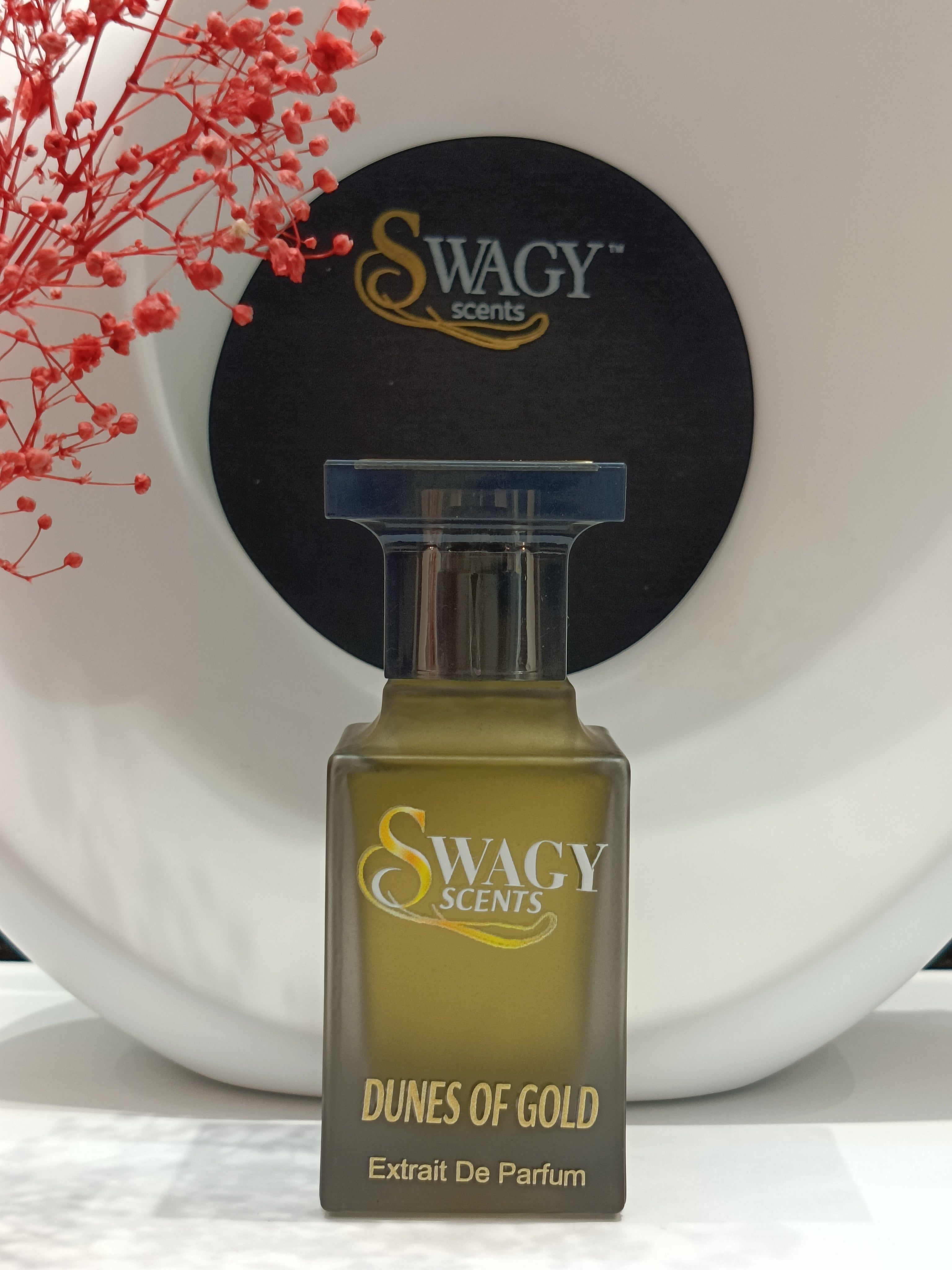 Dunes Of Gold Eau de Parfum by Swagy Scents captures the essence of sunlit dunes and timeless strength, blending fresh citrus and spice with rich woods and leather. A scent crafted for those who appreciate elegance with an edge. This 100% authentic imported tester brings luxurious character without the luxury price.