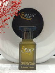 Dunes Of Gold Eau de Parfum by Swagy Scents captures the essence of sunlit dunes and timeless strength, blending fresh citrus and spice with rich woods and leather. A scent crafted for those who appreciate elegance with an edge. This 100% authentic imported tester brings luxurious character without the luxury price.
