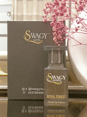 Swagy Scents Royal Forest Eau de Parfum is a captivating blend of vibrant fruits, spicy greens, and deep woods. Inspired by nature’s untamed elegance, it’s crafted for the modern man who commands presence with ease. This 100% authentic imported tester combines standout performance with unbeatable value.