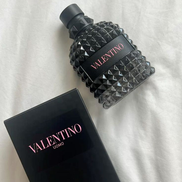 Valentino perfume bottle and packaging on a white background
Valentino Uomo Born in Roma Eau de Toilette captures the essence of modern masculinity with a vibrant burst of violet leaf, blending it with timeless elegance and a smoky, earthy finish. The sophisticated balance of aromatic sage and smoked vetiver gives it a powerful, distinctive character that lingers long after the first spray.&nbsp;This 100% authentic imported tester offers luxury, longevity, and projection at an unbeatable price.