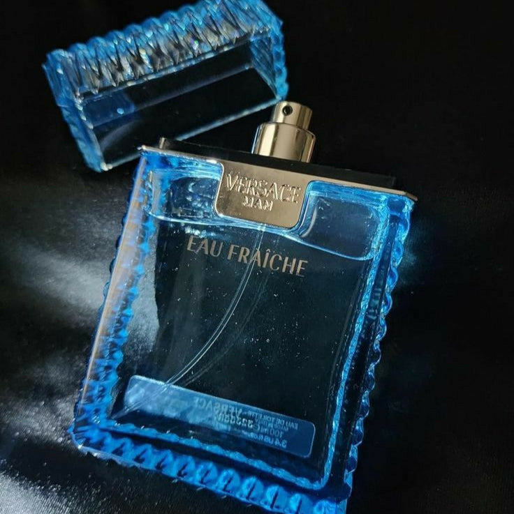 Perfume bottle labeled 'Eau Fraçèche' with blue textured design on a black background
Versace Man Eau Fraîche is a refreshing take on modern masculinity, cool, clean, and charismatic. Blending crisp citrus, aromatic herbs, and deep woody notes, this scent is designed for the man who is effortlessly stylish and refined. This 100% authentic imported tester offers luxury performance without the premium price.